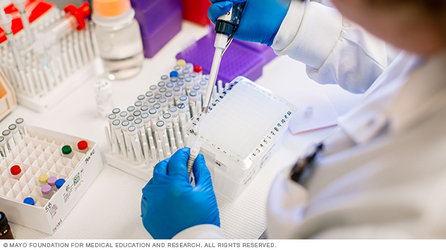 Staff member pipetting in the Targeted Biomarker Core laboratory at Mayo Clinic in Minnesota.