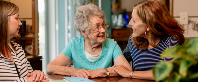 Three generations of women happily interacting