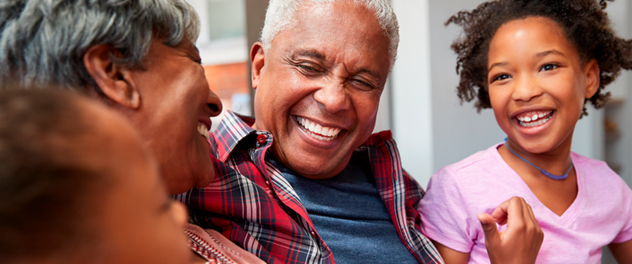 Grandparents laughing with grandchildren