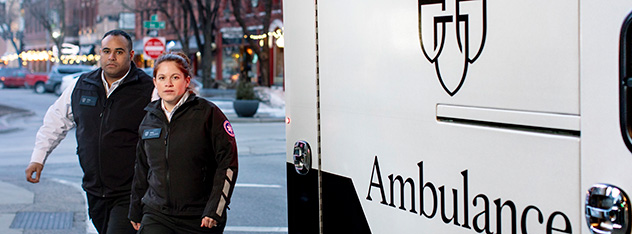 Paramedics in front of a Mayo Clinic ambulance