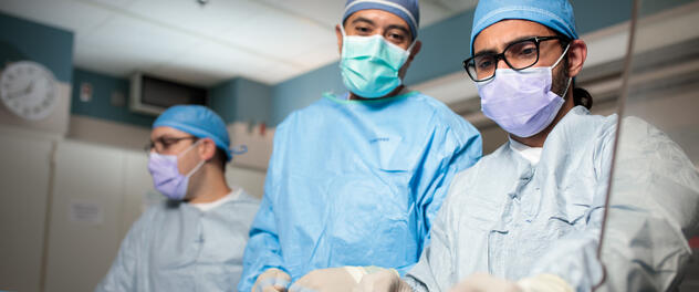 Cardiac regenerative medicine surgeons working in the operating room
