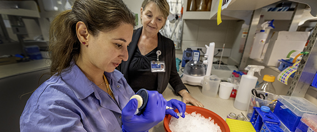 Dr. McLean supervises a staff member during an experiment.