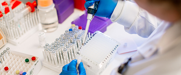 Staff member pipetting in the Targeted Biomarker Core laboratory at Mayo Clinic in Minnesota.