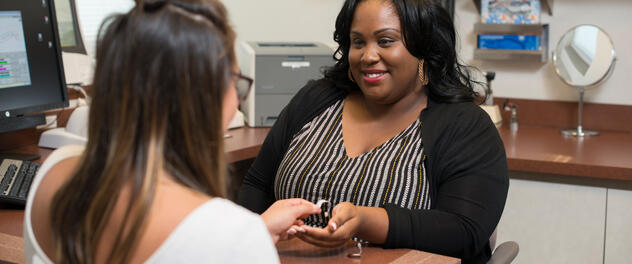 Care provider and patient in hearing aid clinic