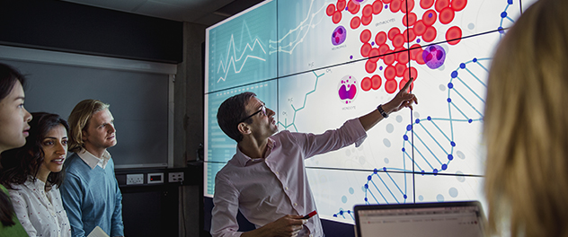 Man presents to colleagues.