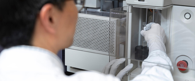 A research scientist prepares specimens for electron microscopy.