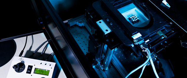 An Alpenglow 3Di microscope and its multiaxis stage controller are shown.