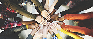 Many hands gathered together.