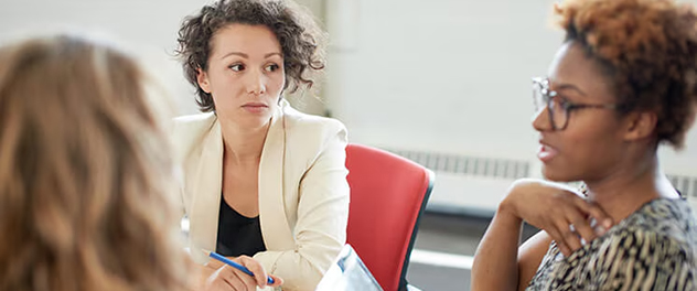 Two people in a meeting.