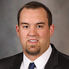 Head and shoulders photograph of Tyler J. Zemla, M.S.